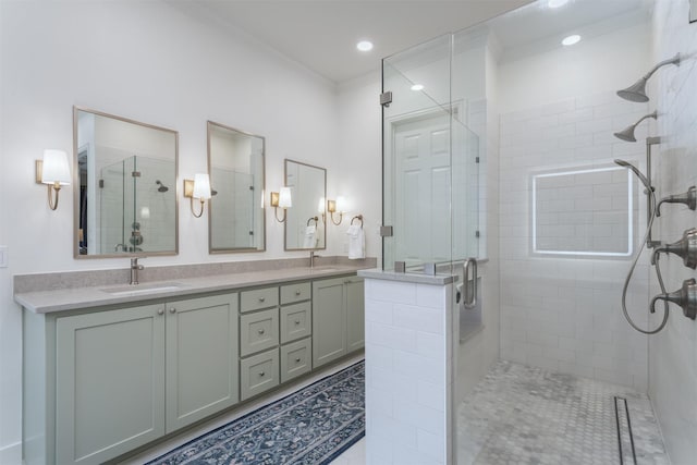 bathroom featuring a sink, crown molding, a shower stall, and double vanity