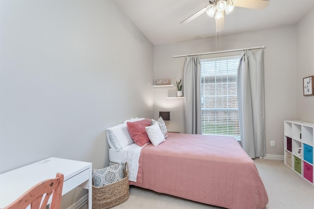 bedroom with baseboards, carpet, and a ceiling fan