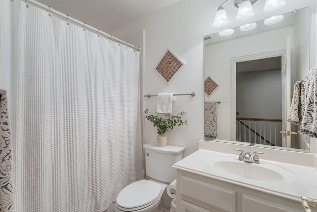full bath with vanity, a shower with shower curtain, and toilet