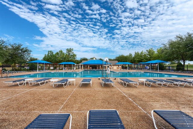 community pool featuring fence