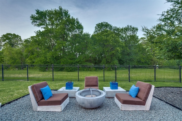 view of patio with fence and a fire pit