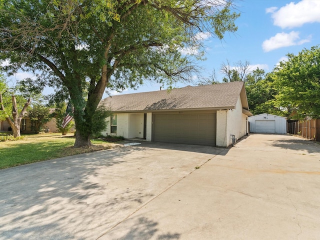 single story home featuring fence, concrete driveway, a front yard, and a garage