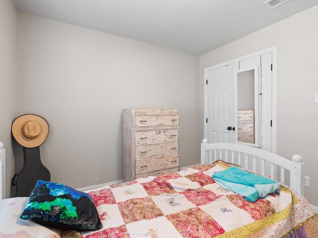 bedroom featuring visible vents