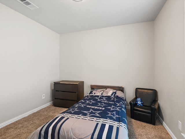 carpeted bedroom featuring baseboards and visible vents