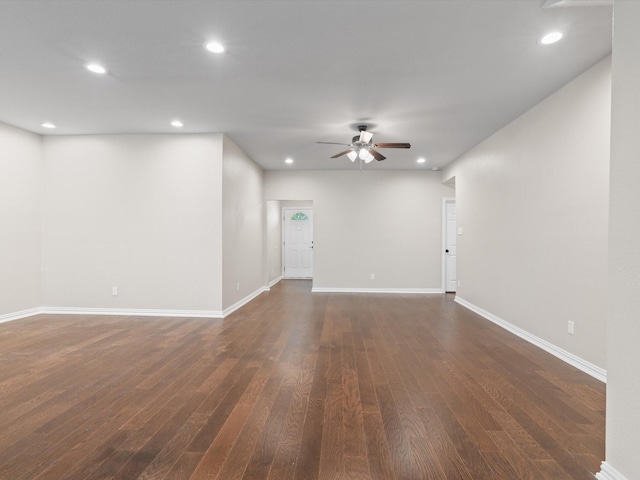 unfurnished living room featuring dark wood-style flooring, a ceiling fan, and recessed lighting