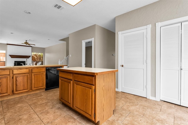 3813 Parkmont Dr, Plano, TX 75023 - kitchen featuring black dishwasher, visible vents, light countertops, a center island, and a ceiling fan