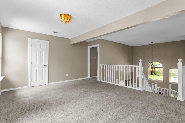3813 Parkmont Dr, Plano, TX 75023 - carpeted spare room featuring a chandelier, baseboards, and visible vents