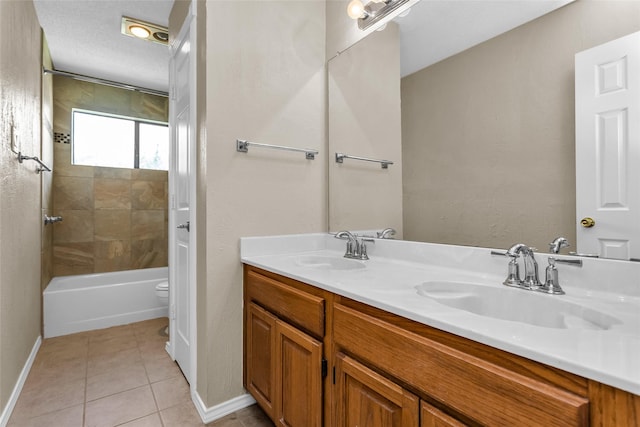 3813 Parkmont Dr, Plano, TX 75023 - bathroom featuring double vanity, tile patterned flooring, baseboards, and a sink