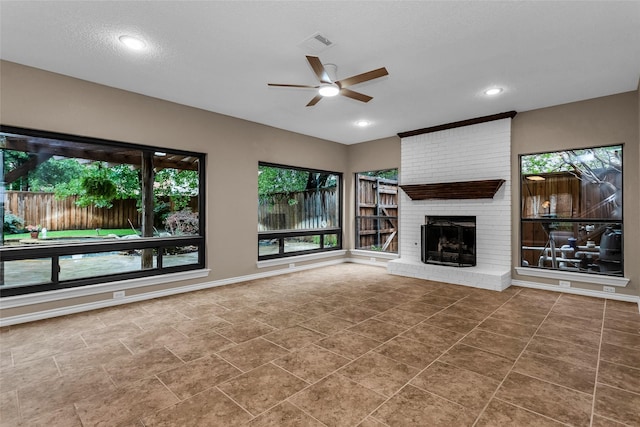 3813 Parkmont Dr, Plano, TX 75023 - unfurnished living room with visible vents, recessed lighting, ceiling fan, a brick fireplace, and baseboards