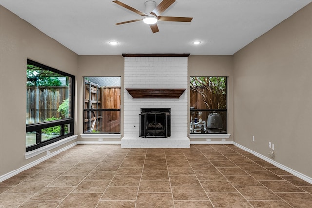 3813 Parkmont Dr, Plano, TX 75023 - unfurnished living room featuring a ceiling fan, a brick fireplace, recessed lighting, and plenty of natural light