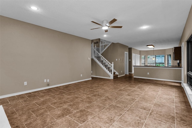 3813 Parkmont Dr, Plano, TX 75023 - unfurnished living room with baseboards, stairs, recessed lighting, and ceiling fan