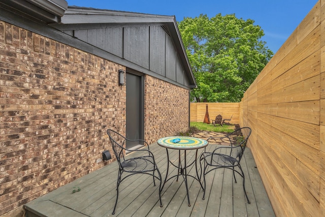 deck with a fenced backyard