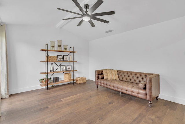 living area featuring visible vents, a ceiling fan, baseboards, and wood finished floors