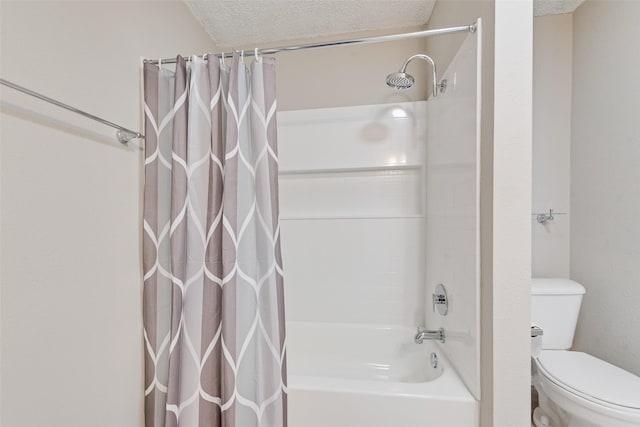 bathroom with a textured ceiling, shower / bathtub combination with curtain, and toilet
