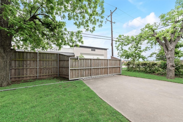 view of yard with a gate and fence