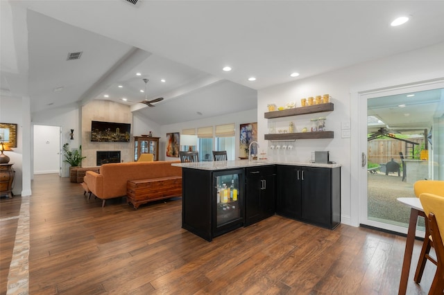 bar featuring a ceiling fan, a wealth of natural light, and wine cooler