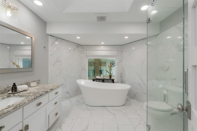 bathroom featuring vanity, toilet, marble finish floor, a soaking tub, and recessed lighting