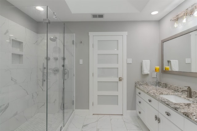 bathroom with a marble finish shower, baseboards, marble finish floor, and visible vents
