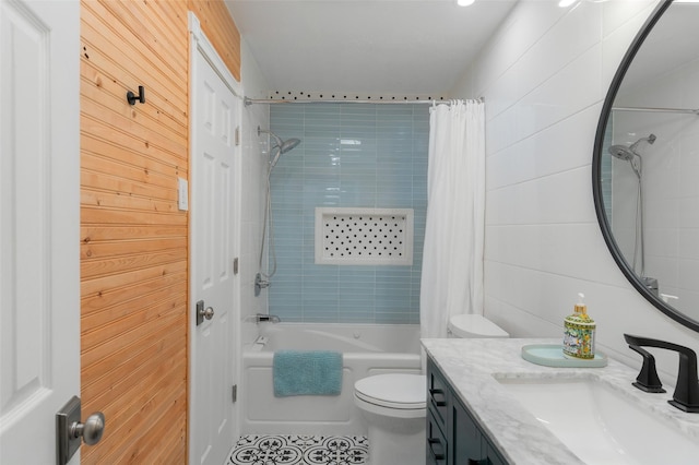 bathroom featuring vanity, toilet, and shower / tub combo