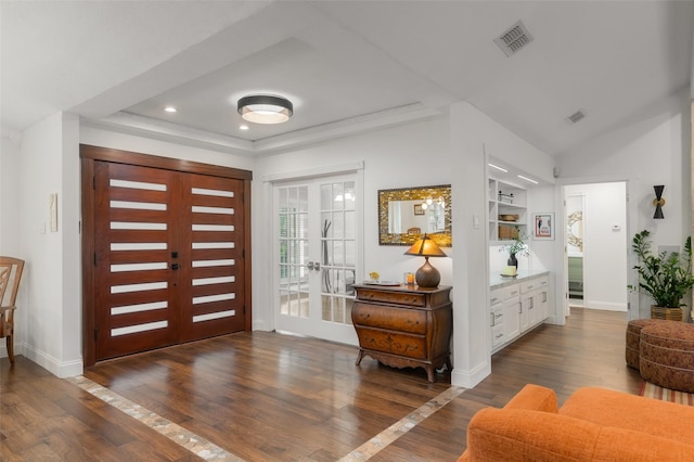 foyer entrance with recessed lighting, hardwood / wood-style floors, and visible vents