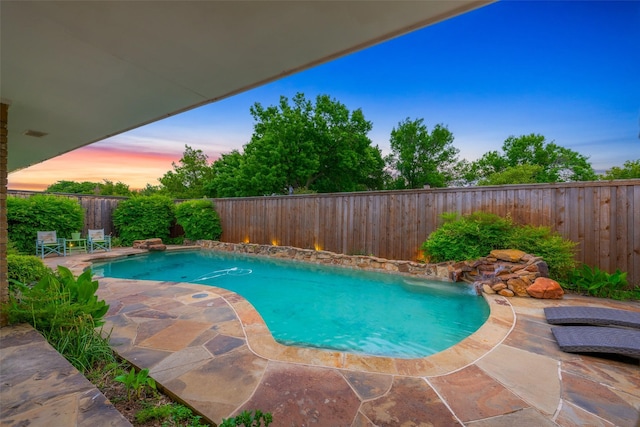 view of swimming pool featuring a patio, a fenced in pool, and a fenced backyard
