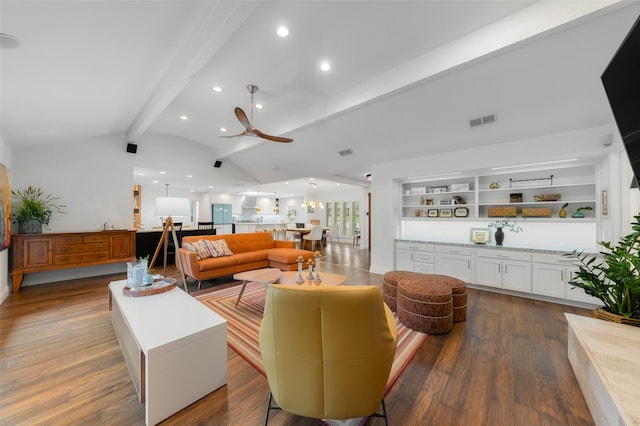 living room with visible vents, dark wood finished floors, ceiling fan with notable chandelier, vaulted ceiling with beams, and recessed lighting