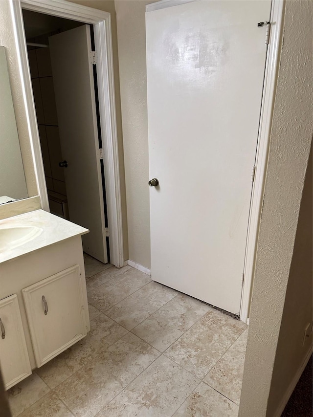 bathroom with vanity and tile patterned floors