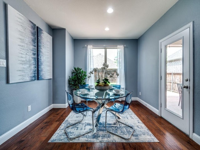 dining area featuring baseboards, recessed lighting, and wood finished floors