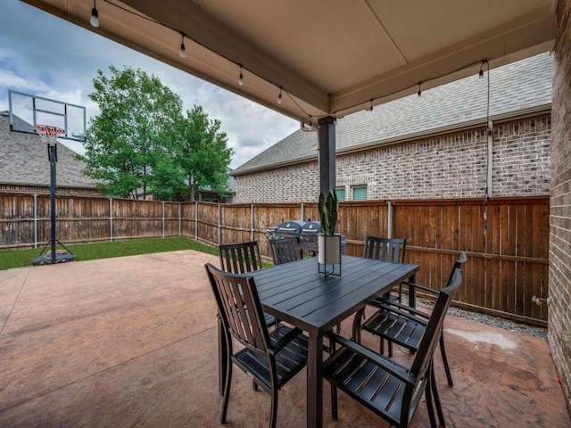 view of patio / terrace with a fenced backyard and outdoor dining area