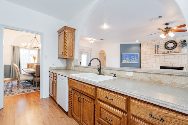 543 Islet Dr, Runaway Bay, TX 76426 - kitchen featuring dishwasher, arched walkways, light countertops, a ceiling fan, and backsplash