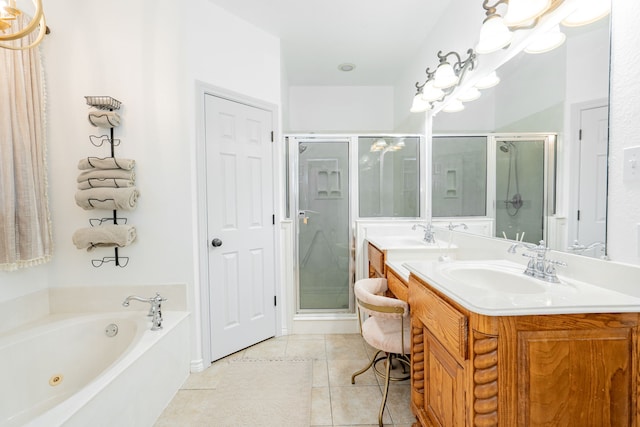 bathroom with double vanity, a stall shower, a sink, tile patterned floors, and a whirlpool tub