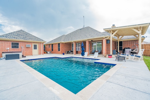 view of pool with a patio, a fenced in pool, and a fire pit