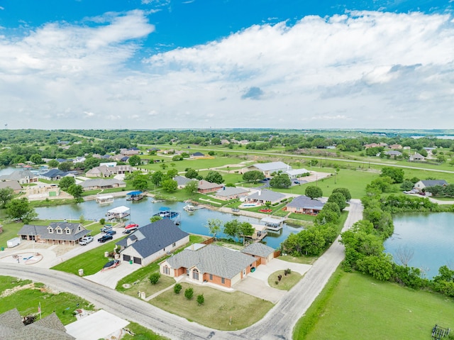 birds eye view of property featuring a water view and a residential view