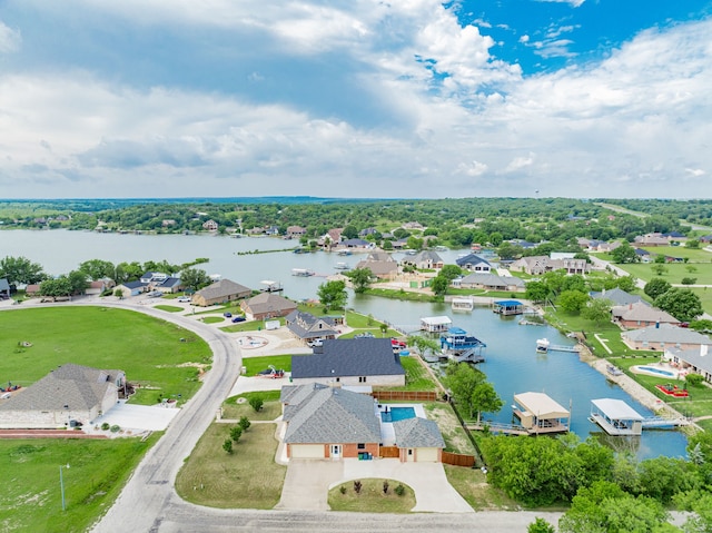 543 Islet Dr, Runaway Bay, TX 76426 - aerial perspective of suburban area featuring a large body of water