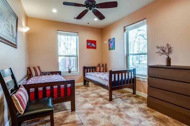 bedroom featuring visible vents, recessed lighting, baseboards, and multiple windows