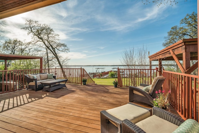 wooden terrace featuring a pergola and a water view