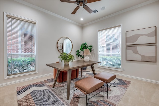 office featuring visible vents, crown molding, baseboards, a ceiling fan, and carpet