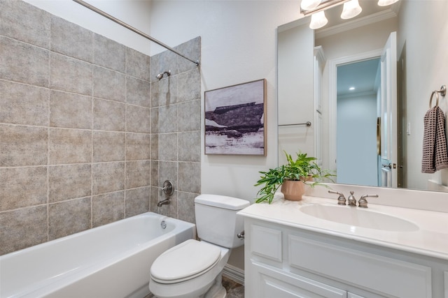 bathroom featuring crown molding, toilet,  shower combination, and vanity