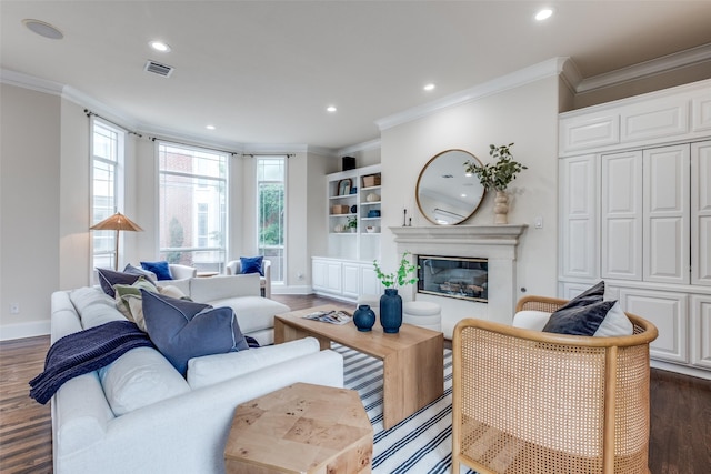 living area with ornamental molding, dark wood-type flooring, and visible vents