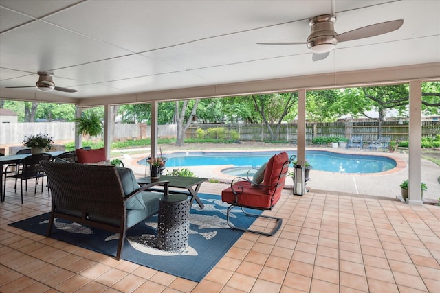 view of swimming pool with a fenced in pool, a ceiling fan, a patio area, and a fenced backyard