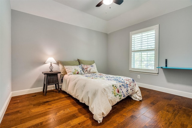full bath featuring a sink, bathing tub / shower combination, double vanity, and wood finished floors