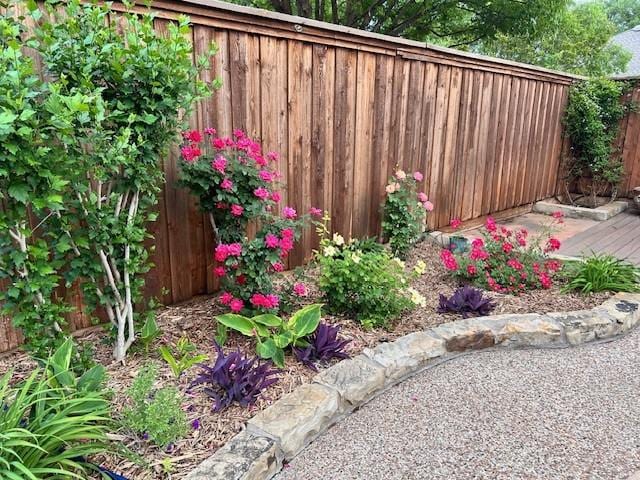 exterior space with brick siding and fence