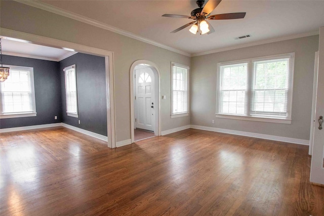 foyer with baseboards, ceiling fan with notable chandelier, wood finished floors, and visible vents