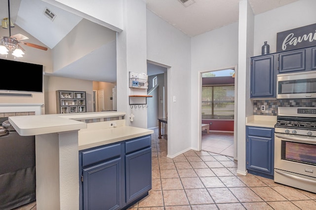 kitchen with visible vents, light countertops, stainless steel appliances, a ceiling fan, and blue cabinetry