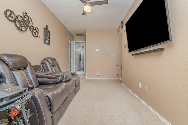 living area with light colored carpet, a ceiling fan, baseboards, and visible vents