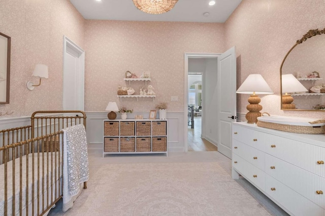 14336 Capridge Rd, Fort Worth, TX 76008 - carpeted bedroom with a crib, wainscoting, a decorative wall, and recessed lighting