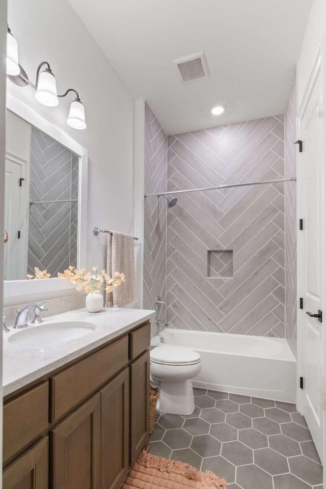 14336 Capridge Rd, Fort Worth, TX 76008 - full bath featuring toilet, bathtub / shower combination, vanity, tile patterned floors, and recessed lighting
