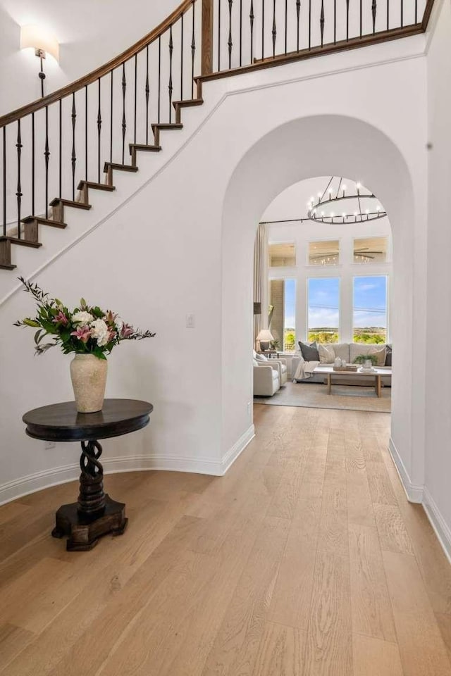 14336 Capridge Rd, Fort Worth, TX 76008 - hall with wood finished floors, arched walkways, and baseboards