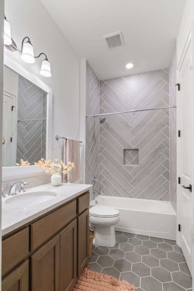 full bath with visible vents, vanity, toilet, recessed lighting, and shower / washtub combination
