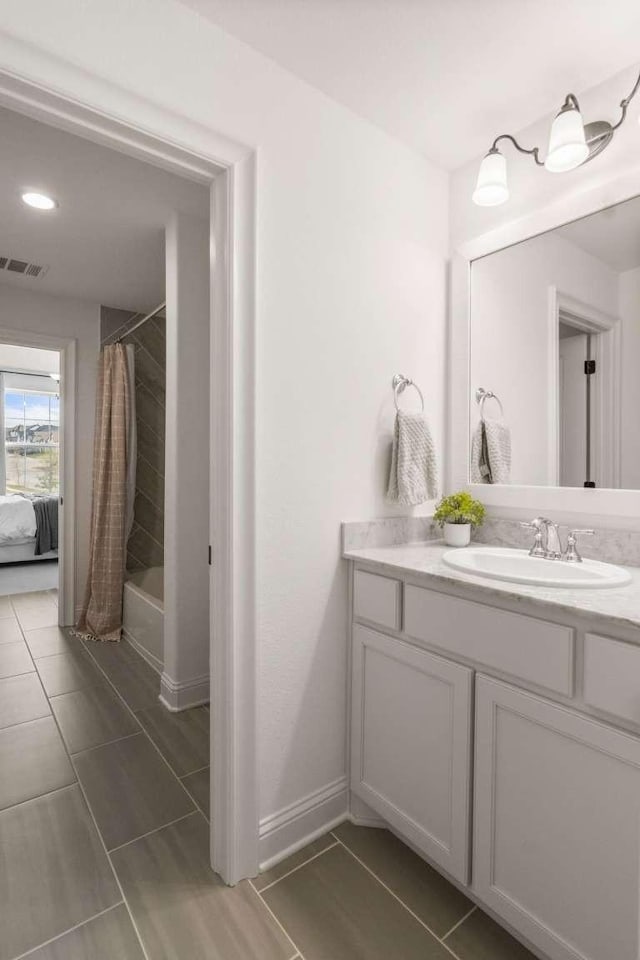 14336 Capridge Rd, Fort Worth, TX 76008 - full bath with vanity, shower / tub combo, tile patterned flooring, baseboards, and recessed lighting